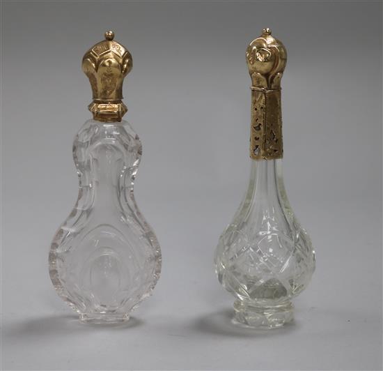 Two late 19th/early 20th century gold topped cut glass scent bottles, tallest 12cm.